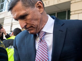 Former National Security Advisor General Michael Flynn leaves after the delay in his sentencing hearing at US District Court in Washington, DC, December 18, 2018.