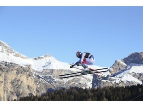 France's Adrien Theaux speeds down the course during a men's World Cup downhill, in Val Gardena, Italy, Saturday, Dec. 15, 2018.