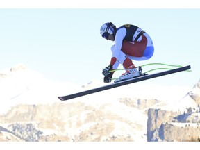 Switzerland's Marc Gisin speeds down the course during a men's World Cup downhill, in Val Gardena, Italy, Saturday, Dec. 15, 2018.