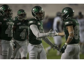 Eastern Michigan defensive back Blake Bogan (23) high fives wide receiver Mathew Sexton (87) after Sexton blocked a punt during the Camellia Bowl  NCAA college football game  in Montgomery, Ala., on Saturday, Dec. 15, 2018.