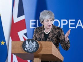 British Prime Minister Theresa May speaks during a news conference at a European Union leaders summit in Brussels, Belgium, on Friday.