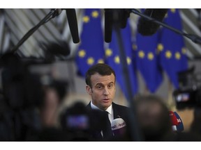 French President Emmanuel Macron arrives for an EU summit in Brussels, Thursday, Dec. 13, 2018. EU leaders gather Thursday for a two-day summit which will center on the Brexit negotiations.