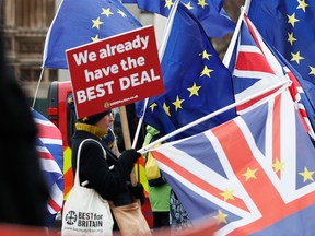 Pro and anti Brexit demonstrators outside the Houses of Parliament in London, Dec. 18, 2018.