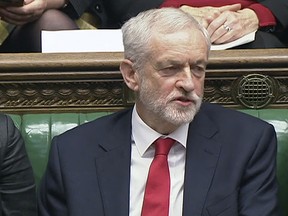 In this screen grab from House of Commons video, Labour leader Jeremy Corbyn says something under his breath after Prime Minister Theresa May likened his party's attempt to table a no confidence motion in her to a pantomime, in the House of Commons on Wednesday Dec. 19, 2018.