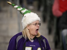 A Baltimore Ravens fan yells during warms ups before an NFL football game against the Los Angeles Chargers Saturday, Dec. 22, 2018, in Carson, Calif.