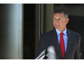 FILE - In this Tuesday, July 10, 2018 file photo, former Trump national security adviser Michael Flynn leaves federal courthouse in Washington, following a status hearing. Flynn is relaxed and hopeful even as the possibility of prison looms when he's sentenced in the Russia probe Tuesday, Dec. 18, 2018. The retired three-star general pleaded guilty last year to lying to the FBI about conversations he had with the then-Russian ambassador to the U.S. during President Donald Trump's White House transition.