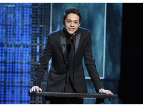 FILE - In this March 14, 2015, file photo, Pete Davidson speaks at a Comedy Central Roast at Sony Pictures Studios in Culver City, Calif. New York police were concerned about Davidson after he wrote "I don't want to be on this earth anymore" on Instagram. And they visited the "Saturday Night Live" star Saturday, Dec. 15, 2018, to make sure he was OK.
