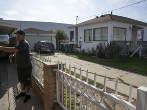 Candido Delgado, a next-door neighbor of a home where Elon Musk's Boring Company plans to build an elevator shaft below the property for the company's underground tunnel project, gets into his pickup truck Tuesday, Dec. 18, 2018, in Hawthorne, Calif.