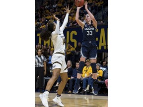 Connecticut guard/forward Katie Lou Samuelson (33) shoots as California guard Kianna Smith (14) defends in the third quarter of an NCAA college basketball game Saturday, Dec. 22, 2018, in Berkeley, Calif.