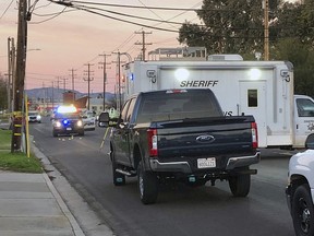 Police investigate the scene of a shooting that took the life of Newman Police Officer Ronil Singh, 33, on Wednesday, Dec. 26, 2018, in Newman, Calif. Authorities were searching Wednesday for a gunman who shot and killed the police officer during a traffic stop in California.