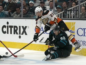 Anaheim Ducks defenseman Brandon Montour (26) battles for the puck against San Jose Sharks right wing Kevin Labanc (62) during the first period of an NHL hockey game in San Jose, Calif., Thursday, Dec. 27, 2018.