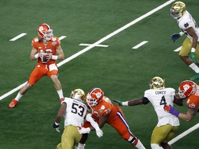 Clemson quarterback Trevor Lawrence (16) prepares to throw fro the pocket in the first half of the NCAA Cotton Bowl semi-final playoff football game against Notre Dame on Saturday, Dec. 29, 2018, in Arlington, Texas.