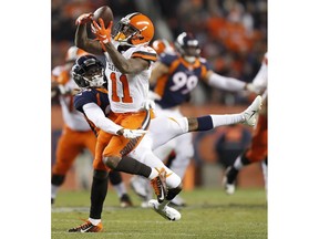 Cleveland Browns wide receiver Antonio Callaway (11) makes a catch as Denver Broncos cornerback Bradley Roby defends during the second half of an NFL football game, Saturday, Dec. 15, 2018, in Denver.