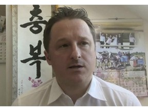 In this image made from video taken on March 2, 2017, Michael Spavor, director of Paektu Cultural Exchange, talks during a Skype interview in Yangi, China. Canadian diplomats have been granted consular access to Spavor, one of two Canadians arrested in China earlier this week. In a statement, Global Affairs says John McCallum, Canada's ambassador to China, met with Spavor today. THE CANADIAN PRESS/AP
