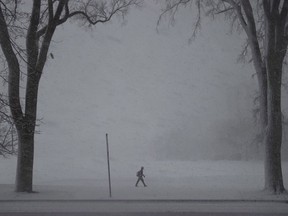 Environment Canada is warning of a mixed bag of messy weather headed for the Maritimes. A pedestrian walks through blizzard-like conditions in Halifax as heavy snow, high winds and pounding surf hit most of Atlantic Canada on Tuesday, March 13, 2018.