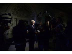 Transport Minister Marc Garneau speaks to reporters during a press conference on Parliament Hill in Ottawa on October 2 2018. The federal government is enacting strict new measures to curb airline pilot fatigue to address mounting concerns about tired flight crews. New regulations the government is introducing will set lower limits for the number of hours a pilot can be in the air and on duty before needing a break. Transport Minister Marc Garneau says the management system provides specialty airlines, such as those in the North, with a bit flexibility.