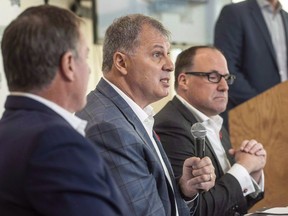 CFL commissioner Randy Ambrosie, centre speaks to reporters during a press conference with Maritime Football Limited Partnership founding partners Bruce Bowser, left, and Anthony LeBlanc in Halifax on Wednesday, November 7, 2018. The Canadian Football League will stage a regular-season game in an undetermined location in Atlantic Canada in 2019, continuing the drive to put a franchise in Halifax within a few years.