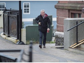 Dennis Oland walks to the Law Courts in Saint John, N.B., on Tuesday, Nov. 6, 2018. A talkative Dennis Oland chatted with police at length about his relationship with his difficult dad, Richard, initially unaware that investigators were narrowing in on him as the prime suspect in his father's murder.