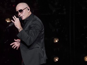Pitbull performs in concert at Madison Square Garden in New York, June 30, 2017. A catchy tune by the rapper Pitbull may be stuck in the heads of many Canadians after it was played 14 times in the country's first win of this year's world junior hockey championship.