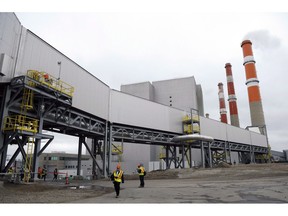 Part of a carbon capture and storage facility is pictured at the Boundary Dam Power Station (background) in Estevan, Sask. on Thursday, October 2, 2014. The death knell for coal-fired electricity in Canada is set to ring in just over 12 years. Ottawa put the final regulations in effect this week which set such strict pollution standards for coal-power plants there is only one plant in Canada that can possibly meet them.