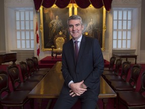 Premier Stephen McNeil poses for a photo before a year-end media interview in the Red Chamber at the legislature in Halifax on Wednesday, Dec. 19, 2018. The Legislative Council, Nova Scotia's upper house, met in the Red Chamber until it was abolished in 1928.