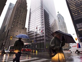 The Canadian economy entered 2018 on an unexpectedly impressive run. The country begins 2019 on a healthy note but signs of weakness have raised a key question: how long until the good times come to an end? People walk in Toronto's financial district in Toronto, on Oct. 29, 2012.