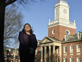 In this Tuesday, Dec. 18, 2018 photo, Michele Fitzpatrick, a retired lieutenant commander in the Coast Guard, poses for a photograph at the United States Coast Guard Academy in New London, Conn. Female veterans, both current and former service members, were more likely to vote in the 2018 midterm elections for Democrats than Republicans, 60 percent to 36 percent, according to data from VoteCast.