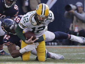 Chicago Bears linebacker Khalil Mack (52) sacks Green Bay Packers quarterback Aaron Rodgers (12) during the first half of an NFL football game Sunday, Dec. 16, 2018, in Chicago.