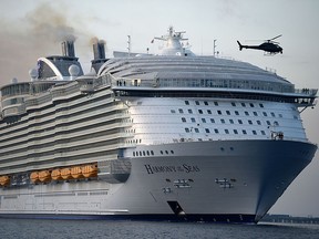 In this May 17, 2016 photo, the world's largest passenger ship, MS Harmony of the Seas, owned by Royal Caribbean, makes her way into Southampton, England.