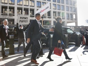President Donald Trump's former National Security Advisor Michael Flynn and his wife Lori Andrade arrive at federal court in Washington, Tuesday, Dec. 18, 2018.