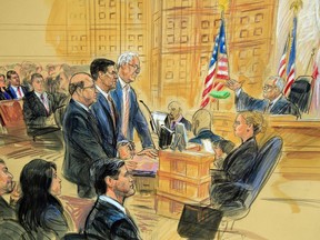 This courtroom sketch depicts former President Donald Trump's former national security adviser Michael Flynn, standing center, flanked by his lawyers, listening to U.S. District Judge Emmet Sullivan, right, as he addresses Flynn and points to the American flag inside the federal court in Washington, Washington, Tuesday, Dec. 18, 2018. Sullivan agreed to postpone Flynn's sentencing so he can continue cooperating with the Russia probe. Flynn's wife Lori Andrade, back left, and son Michael Flynn Jr., with red tie, listen.