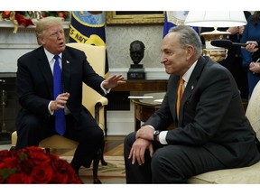 President Donald Trump speaks to Senate Minority Leader Chuck Schumer, D-N.Y., during a meeting with Democratic leadership in the Oval Office of the White House, Tuesday, Dec. 11, 2018, in Washington.