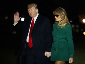 President Donald Trump and first lady Melania Trump arrive on the South Lawn of the White House after making a surprise visit to troops in Iraq, Thursday, Dec. 27, 2018, in Washington.