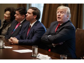 President Donald Trump speaks during a meeting with newly elected governors in the Cabinet Room of the White House, Thursday, Dec. 13, 2018, in Washington. From left, Secretary of Transportation Elaine Chao, Gov.-elect J.B. Pritzker, D-Ill., Gov.-elect Ron DeSantis, R-Fla., and Trump.