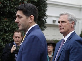 House Majority Leader Kevin McCarthy of Calif., right, listens as House Speaker Paul Ryan speaks briefly to members of the media after they met with President Donald Trump at the White House in Washington, Thursday, Dec. 20, 2018.
