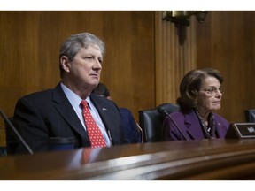 Sen. John Kennedy, R-La., left, and Sen. Dianne Feinstein, D-Calif., listen to testimony as the Senate Judiciary Committee during a hearing to examine China's non-traditional espionage against the United States, on Capitol Hill in Washington, Wednesday, Dec. 12, 2018.