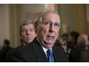 Senate Majority Leader Mitch McConnell, R-Ky., joined at left by Sen. Roy Blunt, R-Mo., speaks after a strategy session, at the Capitol in Washington, Tuesday, Dec. 11, 2018. Under pressure from President Donald Trump and many of his Republican colleagues, Senate Majority Leader Mitch McConnell said Tuesday that he will bring legislation to the floor to overhaul the nation's sentencing laws.