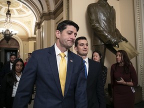 House Speaker Paul Ryan leaves the chamber as a revised spending bill is introduced that includes $5 billion demanded by President Donald Trump for a wall along the U.S.-Mexico border, as Congress tries to avert a partial shutdown, in Washington, Thursday, Dec. 20, 2018.