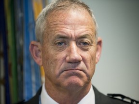 File - In this Thursday, Jan. 8, 2015 file photo, Israeli Defense Minister Benny Gantz pauses as he answers questions from members of the media during his meeting with Joint Chiefs Chairman Gen. Martin E. Dempsey, at the Pentagon. Gantz, former Israeli military chief, says he is running in the upcoming election.