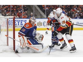 Calgary Flames' Matthew Tkachuk (19) is stopped by Edmonton Oilers goalie Mikko Koskinen (19) during third period NHL action in Edmonton on Sunday, Dec. 9, 2018. Koskinen always knew he'd return to the NHL.The six-foot-seven Finnish goalie was taken 31st overall by the New York Islanders in the 2009 draft but logged just four games with the franchise before returning to Europe in 2011.