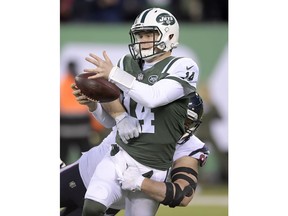 Houston Texans defensive end J.J. Watt, back, sacks New York Jets quarterback Sam Darnold during the first half of an NFL football game, Saturday, Dec. 15, 2018, in East Rutherford, N.J.