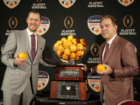 Alabama head coach Nick Saban, right, stands with Oklahoma head coach Lincoln Riley at an NCAA college football news conference in Fort Lauderdale, Fla., Friday, Dec. 28, 2018. Alabama plays Oklahoma in the Orange Bowl on Saturday, Dec. 29.