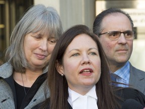 Crown Jill Cameron is flanked by Detective Sgt. Mike Carbone, right, and Linda Babcock after the sentencing of Dellen Millard in Toronto on Tuesday, Dec. 18, 2018.