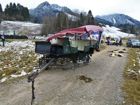 A damaged carriage sits on a path near Pfronten, southern Germany, Tuesday, Dec. 25, 2018. 20 people were injured, two of them seriously, when two horse-drawn carriages collided during a Christmas day outing. The two carriages, each with 10 passengers, were approaching a rail crossing single file when the first carriage halted. The second did not and overturned during the collision.