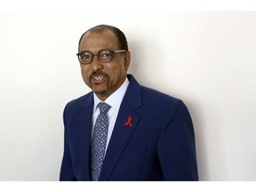 FILE - In this July 18, 2018 file photo embattled UNAIDS chief Michel Sidibe poses for photographers before attending a press conference, in Paris, France. The head of the U.N. agency focusing on AIDS says he'll leave his post in June, an early departure announced a week after independent experts looking into sexual harassment at UNAIDS blasted its "defective leadership."