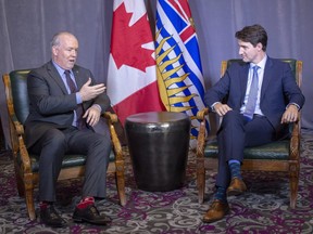 Prime Minister Justin Trudeau meets with British Columbia Premier John Horgan after the First Ministers conference Friday, December 7, 2018 in Montreal.