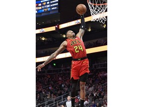 Atlanta Hawks guard Kent Bazemore goes up to dunk against the Washington Wizards during the first half of their NBA basketball game Tuesday, Dec. 18, 2018, in Atlanta.