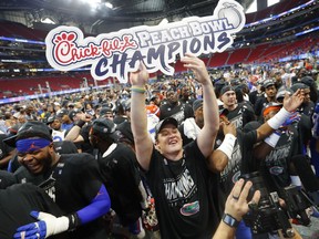 Florida players celebrate after the Peach Bowl NCAA college football game against Michigan, Saturday, Dec. 29, 2018, in Atlanta. Florida won 41-15.