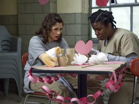 This image released by Netflix shows Yael Stone, left, and Uzo Aduba in a scene from Orange is the New Black.
