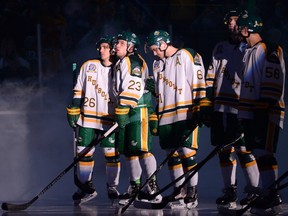 In this Sept. 12, 2018 file photo, Humboldt Broncos forwards Brayden Camrud (26) and Derek Patter (23) embrace before the team's home opener against the Nipawin Hawks.